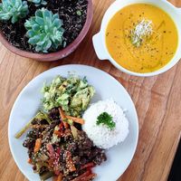 pumpkin and red pepper soup with veggies and soy protein sauté in teryaki sauce with salad and citronela rice  at Lulo's Restaurante in Jardin