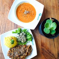 Tomatoes and carrot creamy soup with lentil dhal, fresh salad and rice. at Lulo's Restaurante in Jardin