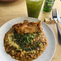 Risotto de Jambu (a fruit from the Amazonian forest) and Cilantrata (a refreshing coriander  drink served with your choice of beer - alcohol free and gluten-free options available) at Jamburita in Brasilia