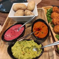 Papas con salsas veganas de remolacha, guacamole y mojo at Pasapan in Segovia