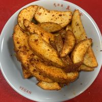 Spicy potato wedges  at Izakaya Masaka in Tokyo