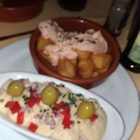 Skewer of tofo and roast veg (not in photo), soya patatas bravas and humus with topping, unlimited olives, bread, and drinks. at Tablo del Carmen in Barcelona