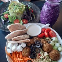 Falafel bowl and avocado supreme salad w smoothie at Super Be Juicery in Marbella