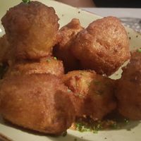 Roasted vegetable fritters with ras el hanout spices and almond and tomato-based Romesco sauce at Blat al Sac in Mallorca