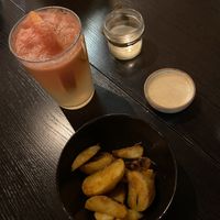 Grapefruit lemonade and potato fries with sauce at Eywa in Moscow