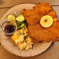 Wie"ner"schnitzel mit Kartoffel und Gurkensalat.
Schnitzel Vienna-Style with potato salad and cucumber salad. at Försters in Berlin