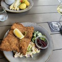 Wiener Schnitzel with potato salad and cucumber salad and aspargus with potatoes  at Försters in Berlin