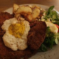 Schnitzel with fried egg and potatoes at Försters in Berlin