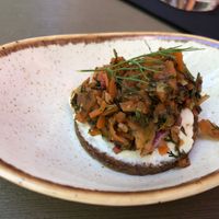 Gruß aus der Küche: Pumpernickel mit Frisch"käse" und Karottenlachs at Försters in Berlin