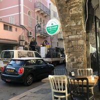 Tables outside, overlooking the flee market at Hummus Eliyahu - Jaffa Flea Market in Tel Aviv