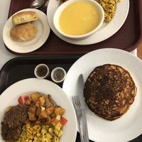 Brunch special for 2: biscuits, grits, tofu, potatoes, veggie sausage, pancakes  at Soul Vegetarian - South in Atlanta