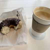 Chocolate donut and oat milk latte   at Johnny Doughnuts in Larkspur
