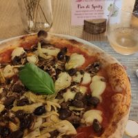 Vegan pizza with artichokes, olives and mushrooms at Il Melograno in Trieste