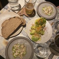 Smoked mushroom with avocado cream, salad with spicy seeds and sour dough bread  at MESA Restaurant in Paris
