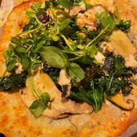 Quinoa flatbread with vegetable creme, cashew-nut cheese and mushrooms. at MESA Restaurant in Paris