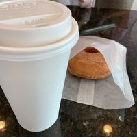 Coconut milk latte (so delicious) with cinnamon and sugar doughnut  at Sugar Donuts in Charlotte