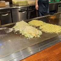 Cooking at the counter at Kurawanka in Miyajima