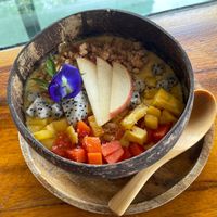 Fruit bowl with coconut water and granola at Jaiyen Resort in Koh Yao Noi