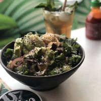 Bowl with rice, avo, tofu, spring unions, cucumber, coriander, salad and miso sauce. at Ma'loa in Cologne