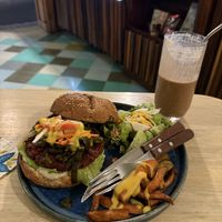 Lentil and beet burger with cacao smoothie almost gone haha  at Elela in Valladolid