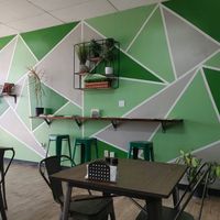 Bookshelves on the wall at Vegan Town in Johnson City