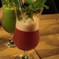 The gin + cucumber and raspberry cocktails. at TA Vegan House in Hamburg