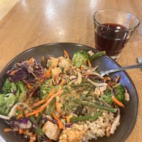 Vegan Thai Bowl and house red winee  at Laughing Planet Cafe - Gabriel Park in Portland