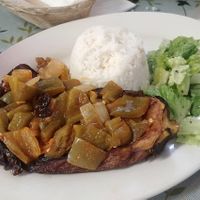 My first intro to imam bayildi - like an eggplant steak - with peppers, pistachio and raisins. Very good but oily😉 at Ephesus Restaurant in Bloomington