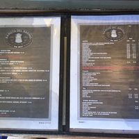 Menu of food and drink options. Vegan tamales available individually or by the dozen.   at Barista Del Barrio in Tucson