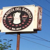 Sign facing road at Barista Del Barrio in Tucson