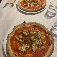 Wood fired marinara pizzas with added artichokes  at Il Forno A Legna in Ronda
