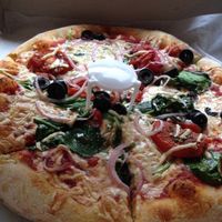 10-inch vegan pizza with vegan cheese, black olives, tomatoes, spinach, and onions at Spak Brothers in Pittsburgh
