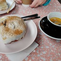 A cinnamon roll pillow with cream cheese frosting and an espresso at It's a Trap in Dublin