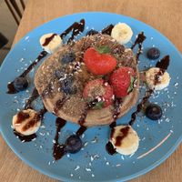 Whole meal pancakes with almond butter and fresh fruit at Ethos Brothers in Brentwood