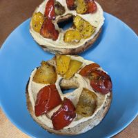 Potato Bagel with Hummus and Peppers at Ethos Brothers in Brentwood