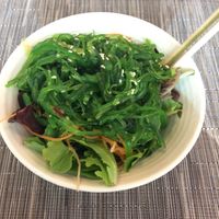 wakame salad. It was a little bit of seaweed salad on top of some mixed greens, so kind of a rip off. at IAH - Yume Asian Kitchen - TE in Houston