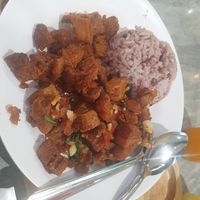 Spicy fried garlic 'pork' with rice - 6/10 flavour there but too crispy and dry and cold but I had it at end of day so probs not fresh at So Vegan - Yaowarat​ in Bangkok
