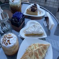 Tomato, Basil, Corn and Cheese Empanada, Almond Milk Caramel Frappe, Snickers Cake and Passionfruit Meringue Cake 🍰   at La Converseria in Santiago