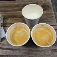 Black Coffee with steamed oat Milk in separate cup at Otto Waffle Atelier in Bruges