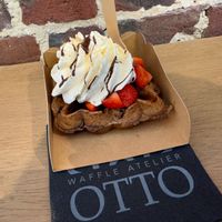 Vegan waffle, strawberry’s, chocolate sauce and whipped cream. WOW  at Otto Waffle Atelier in Bruges