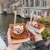 Waffles with vanilla ice-cream and melted chocolate at Otto Waffle Atelier in Bruges