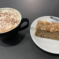 Apple cake and oat milk cappuccino. at The Quirk Space in Olney