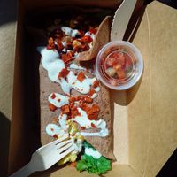 Breakfast burrito to go: messy but delicious. at Portia's Diner in Clintonville