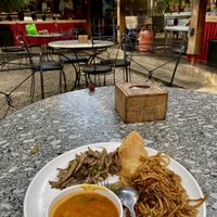 Breakfast buffet: vegan tarkari, puri, sautéed mushrooms and fried noodles  at Utpala Café in Kathmandu