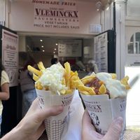 (Left) medium fry with vegan Mayo and onion, (right) medium fry with vegan Mayo and curry ketchup   at Vleminckx Sausmeesters in Amsterdam