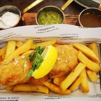 Vegan Fish n Chips with tartare sauce, mushy peas, and sauce. at Mayfair Chippy in West London