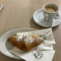 Vegan croissant with apricot filling, caffè crema  at Caffe Spettacolo - Wiedikon in Zurich
