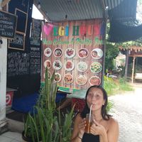 Menu options and outside seating at Vegi House in Singaraja