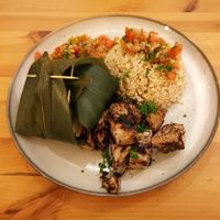 Jackfruit 'fush' fillets with miso paste, steamed vegetables in bamboo leaves, and rice with a tomato salsa at Ventre Content in Liege