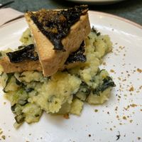 This was amazing their take on traditional portiguese Boneless Lagareiro - Marinated organic tofu with garlic sauteed cabbage sprouts and roughly mashed potatoes! at The Green Affair - Chiado in Lisbon
